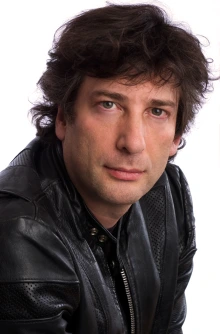 professional headshot photo of nick glass, dark hair, fair skin, black leather jacket, white background