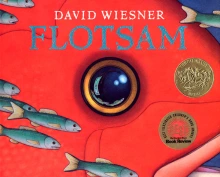 Cover of Flotsam depicting a circular camera lens, which resembles an eye, in the middle of a red cover. Small blue fish swim by in the bottom left corner.