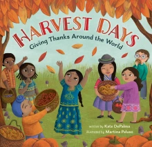 A group of people of all different cultures gather together to celebrate an autumn harvest.