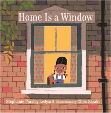 A young Black girl with pigtails looks out the window fo a brick building.