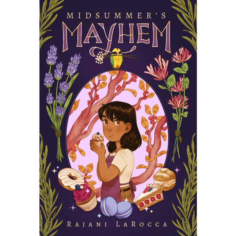 A young girl in an apron holds a cupcake