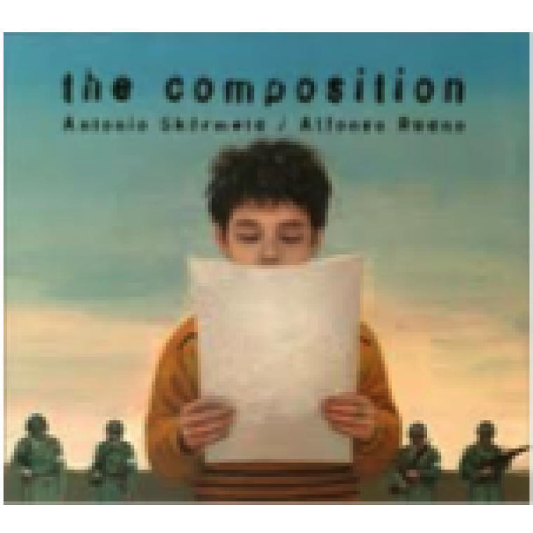 A young white boy looks down at papers in his hands