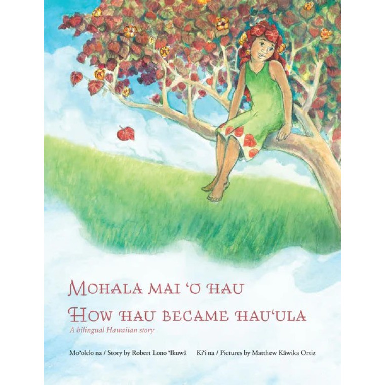 A young girl sits on a tree branch