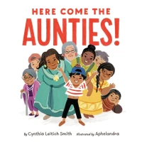 A young child surrounded by a group of aunties