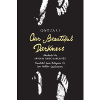 Two pairs of feet barely illuminated in pitch darkness.
