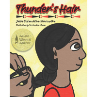 A young child gets his hair braided 
