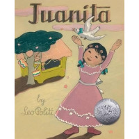 A young girl in a pink dress releases a white dove.