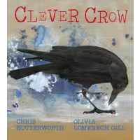A black crow investigates the ground. 