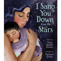 A mother is holding her new born underneath the night sky
