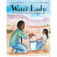 A girl is holding a bucket of water and passing it to a younger girl