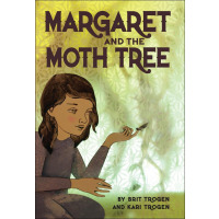 A girl is holding a moth on her finger