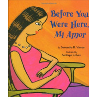 A pregnant woman cradles her large belly.
