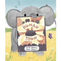 An elephant holds a poster with the title on it.