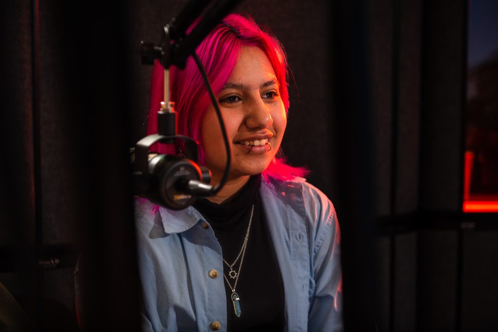 Reading Ambassador smiles into microphone