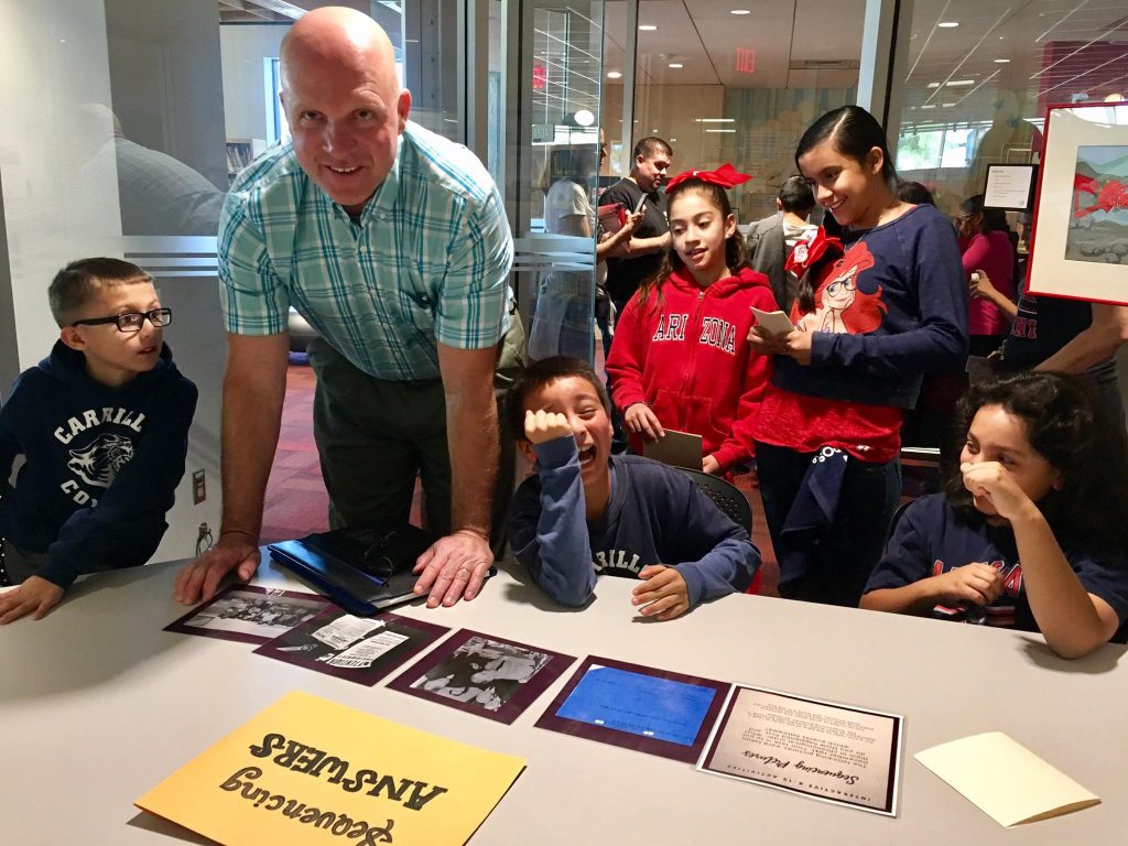 Kids laughing while working with a timeline activity