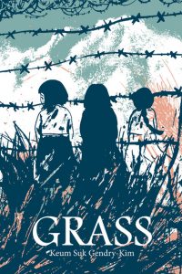 Three young girls stand among tall grass in front of a barbed wire fence.