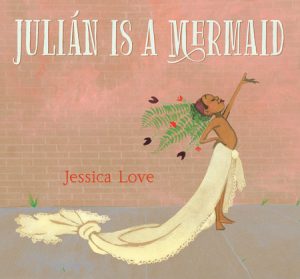 Julian Is a Mermaid Cover featuring a child posed with an arm in the air and wrapped in a sheet at the waist and a headdress of flowers