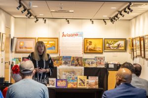 Kathy Short presenting the exhibit at reception