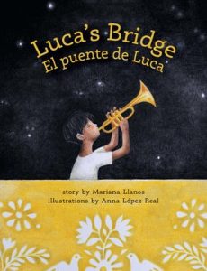 Cover of Luca's Bridge El Puente de Luca features boy playing trumpet against a night sky