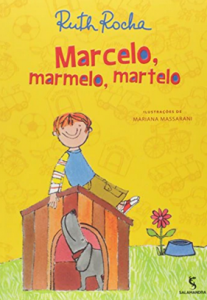 A young boy sits on top of a dog house.