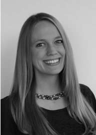 Woman with long straight blond hair smiles at the camera