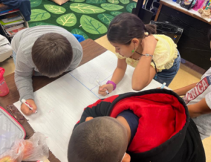 Students working on creating a graffiti board.