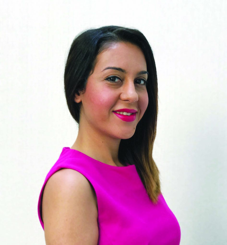 portrait of the illustrator in hot pink dress