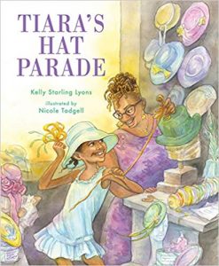 Cover of Tiara's Hat Parade depicting a young black girl smiling with a blue hat on her head as her mother smiles down at her while making a green hat.