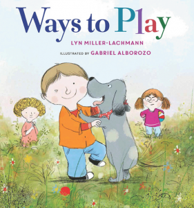 A winking and smiling boy plays with a dog