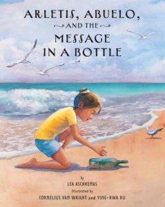 A young girl on the beach reaches down to pick up a green bottle.
