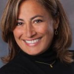 smiling portrait of Beth Ferry in black turtle neck shirt