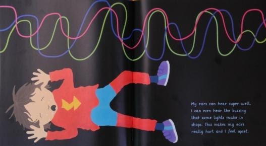 page for Isaac and His Amazing Asperger Superpowers depicting Isaac, a young boy with brown hair and light skin in a red shirt, blue pants, red socks and purple shoes, lying down with his hands next to his ears. Wavy lines in various colors are above him on a black backround. Text reads: My ears can hear super well. I can even hear the buzzing that some lights make in shops. This makes my ears really hurt and I feel upset.